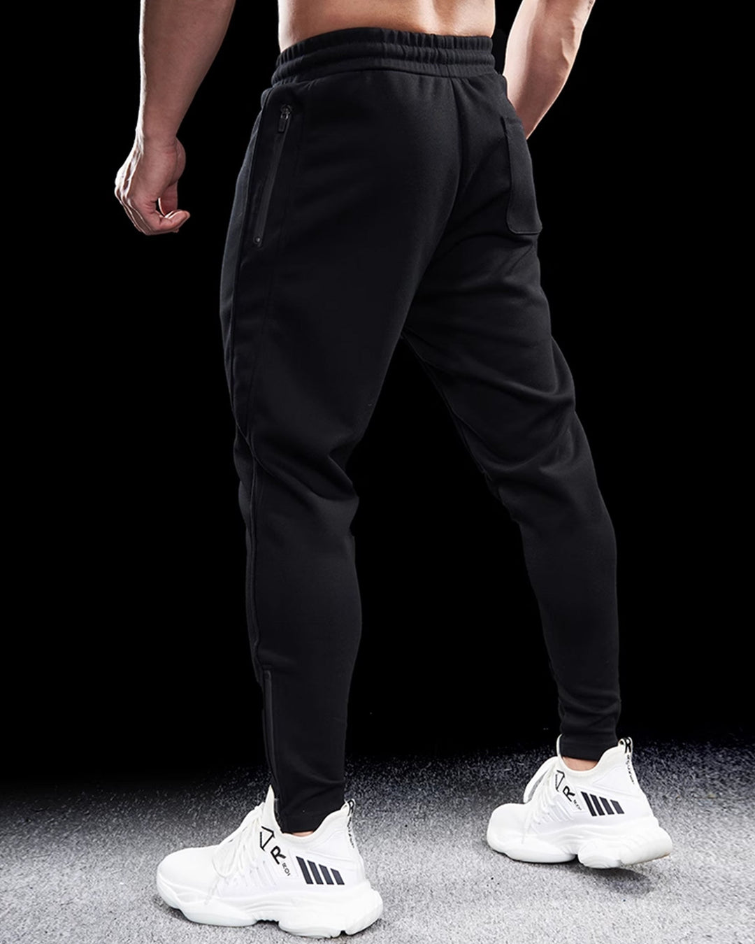 Men's Girona track pants featuring practical zip hems & a modern tapered fit. Ideal for sportswear & casual.