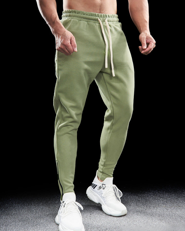 Durable men's Girona sportswear joggers, designed with zip hems. Perfect activewear & comfortable track pants.