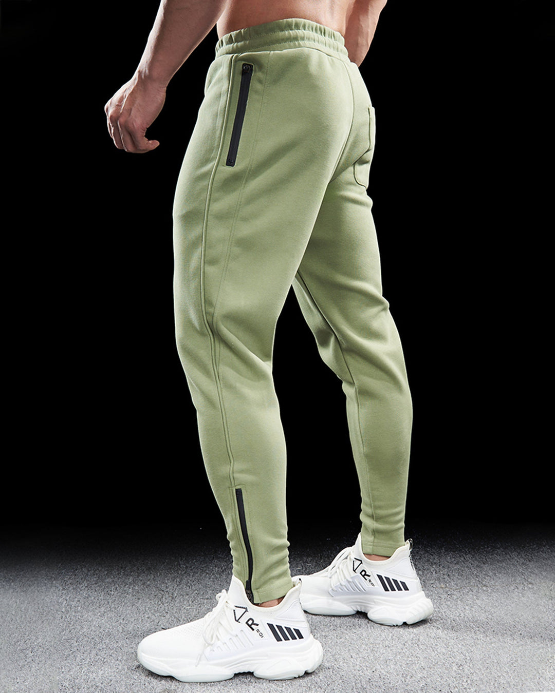 Modern men's Girona athletic sweatpants. Tapered fit joggers with zip hems for comfort & versatility.
