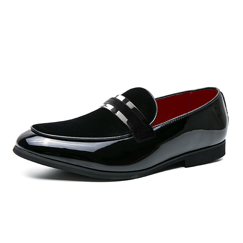 Detailed close-up of men's glossy black dress loafers, showcasing modern formal design & polished finish.