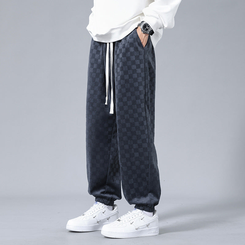 Men's gray & black checkerboard sweatpants for elevated street style. Relaxed fit casual pants.