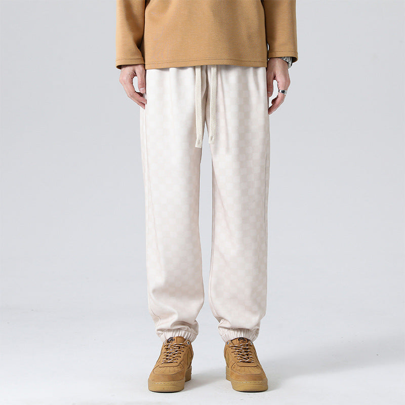 Casual men's gray & black checkerboard lounge pants, perfect for everyday comfort and style.