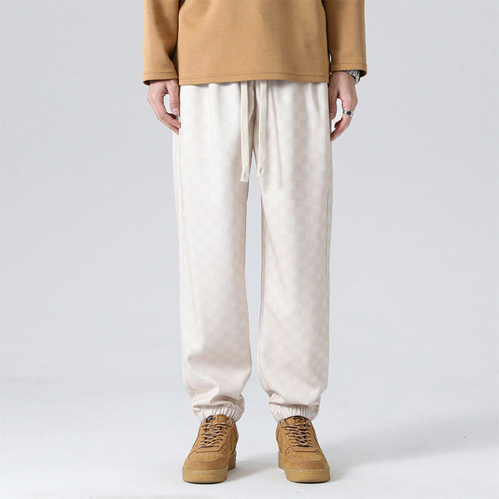 Casual men's gray & black checkerboard lounge pants, perfect for everyday comfort and style.