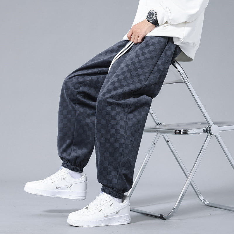 Checkerboard men's lounge pants, gray & black, ideal for activewear or comfortable casual wear.
