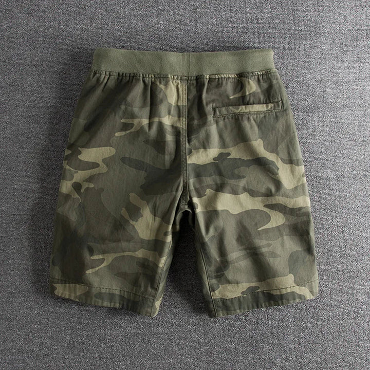Stylish men's green camo shorts for active casual wear. Comfortable summer military shorts, great for outdoor fashion.