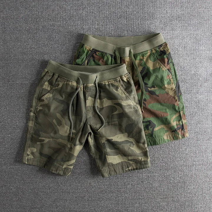Durable men's tactical camo shorts, perfect for outdoor activities & active wear. Stylish & comfortable summer shorts.