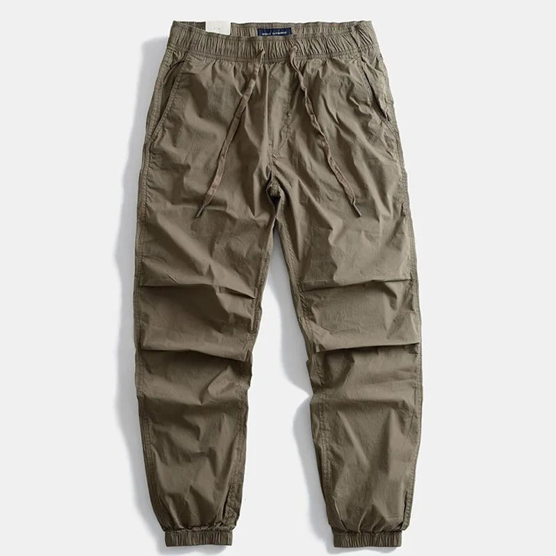 Casual men's khaki cargo pants, durable and comfortable, perfect for outdoor adventures and daily wear.