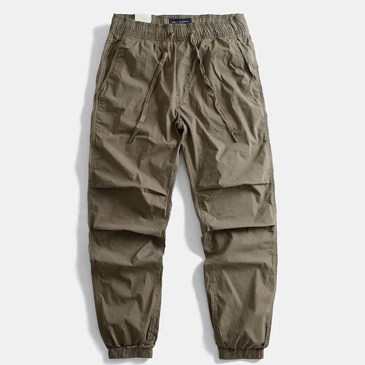 Casual men's khaki cargo pants, durable and comfortable, perfect for outdoor adventures and daily wear.