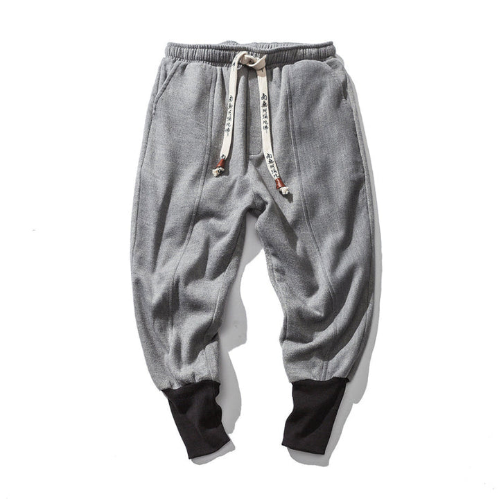 Soft gray men's relaxed fit tapered pants, offering everyday comfort and stylish, versatile appeal.
