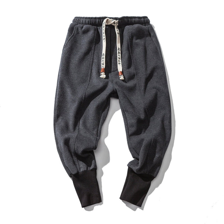 Stylish black men's relaxed tapered pants, perfect for comfortable casual wear and modern mens fashion.