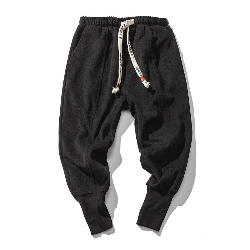 Gray men's drop crotch relaxed fit tapered pants, designed for maximum comfort and a modern silhouette.