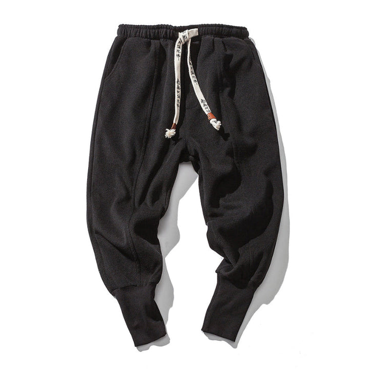 Gray men's drop crotch relaxed fit tapered pants, designed for maximum comfort and a modern silhouette.