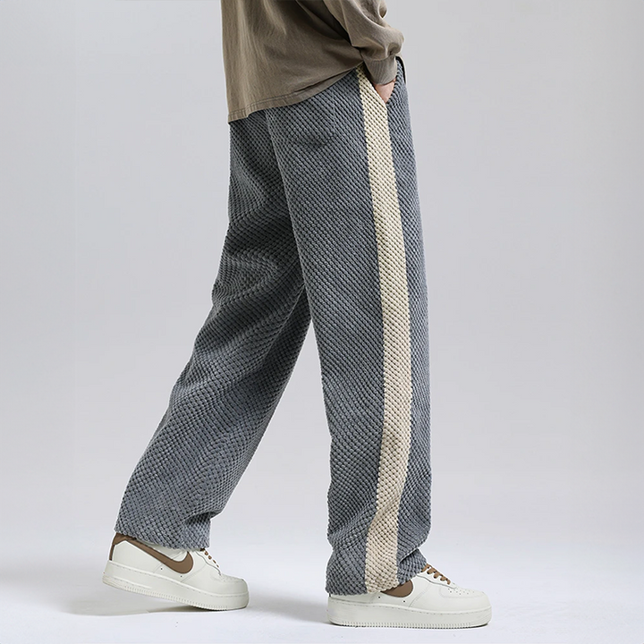 Stylish gray men's waffle corduroy joggers for a modern urban streetwear look, combining comfort & trend.