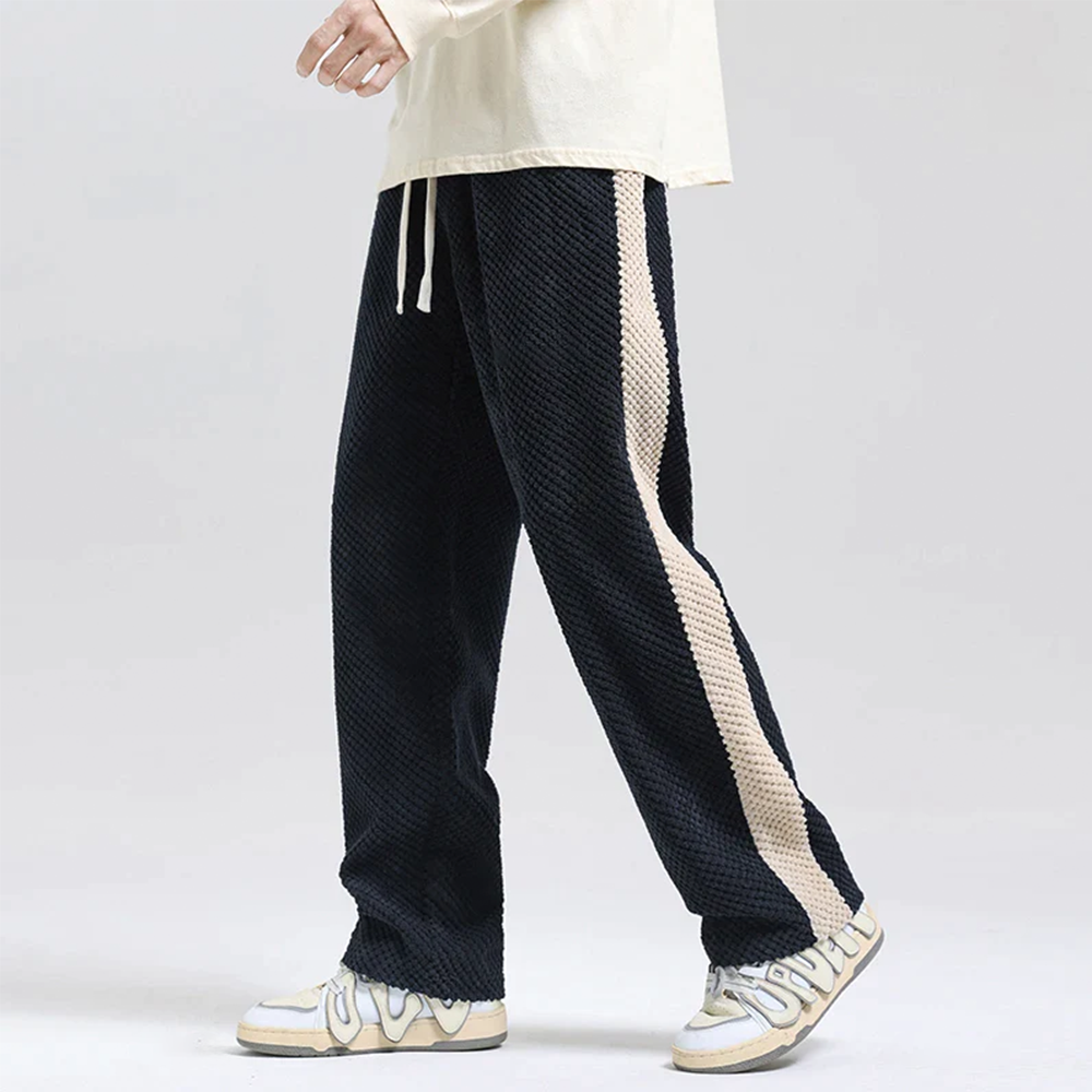 Black men's waffle corduroy joggers with an athletic-inspired fit, great for casual movement & urban comfort.