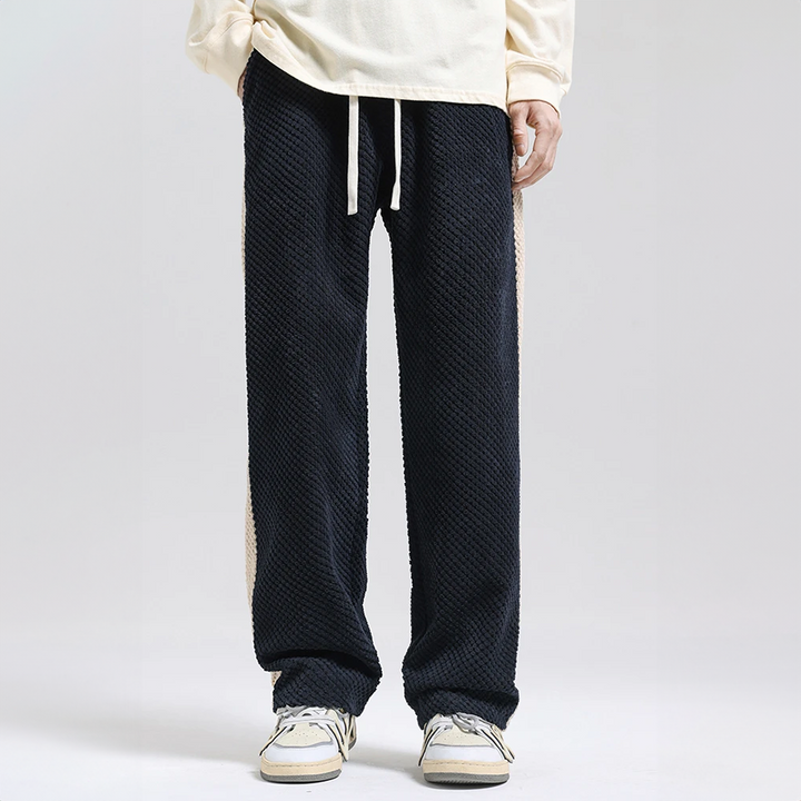 Textured waffle corduroy men's joggers in gray, offering unique fabric & comfortable fit for urban casual wear.