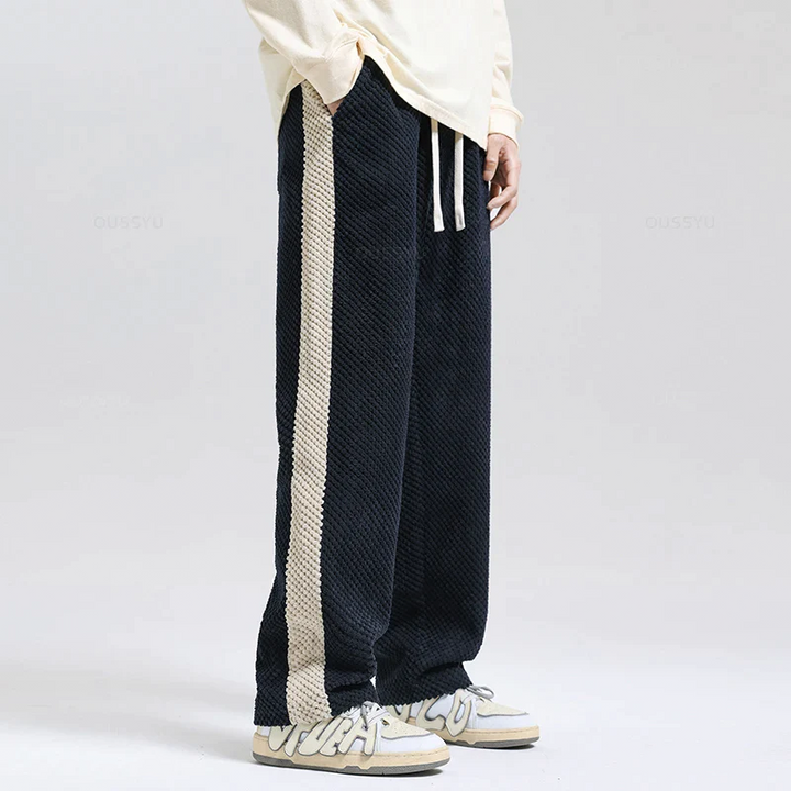 Gray men's waffle corduroy joggers, blending casual comfort with a modern urban streetwear aesthetic. Loungewear.