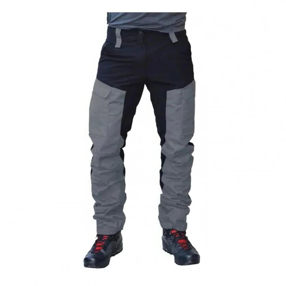 Men's gray weatherproof cargo pants for tough workdays, featuring multiple pockets & durable construction.