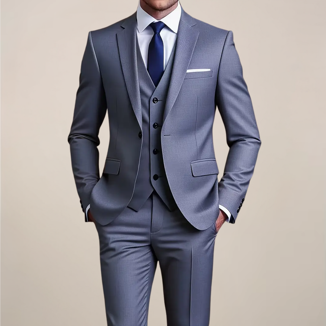 Men's grey slim-fit three-piece suit for formal events, perfect as a wedding or business suit. Tailored tuxedo style.