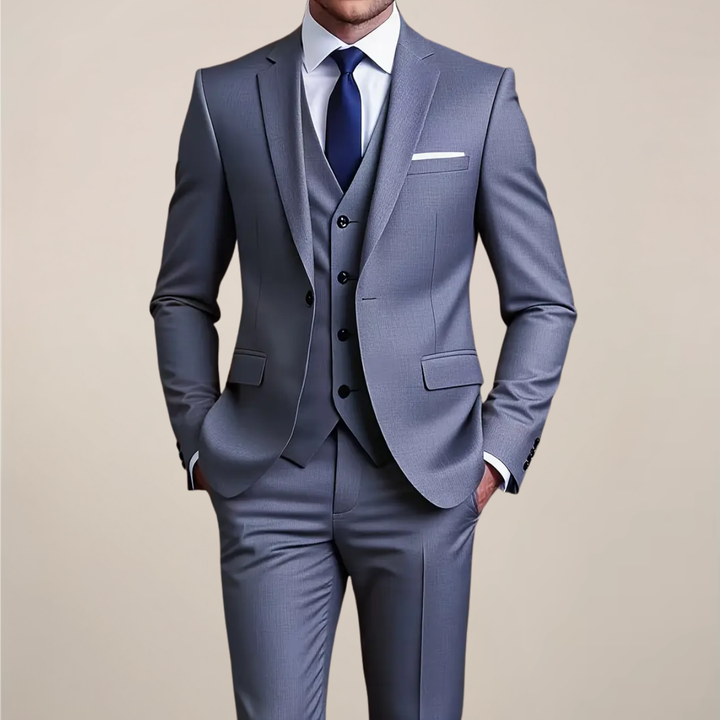 Men's grey slim-fit three-piece suit for formal events, perfect as a wedding or business suit. Tailored tuxedo style.
