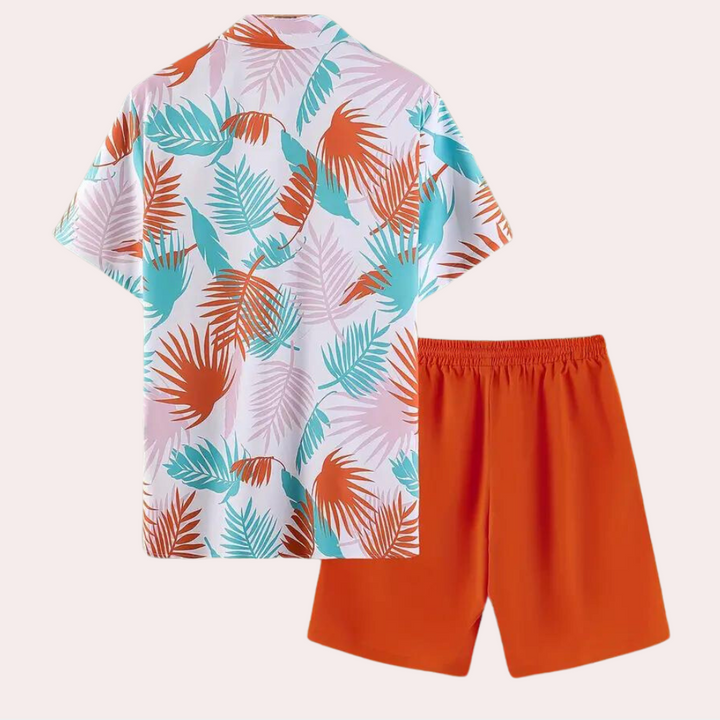 Full view of men's Hawaiian vacation shirt and matching shorts in a vibrant tropical print