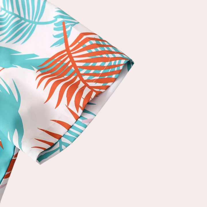 Close-up of men's casual Hawaiian shirt with blue and yellow floral summer print