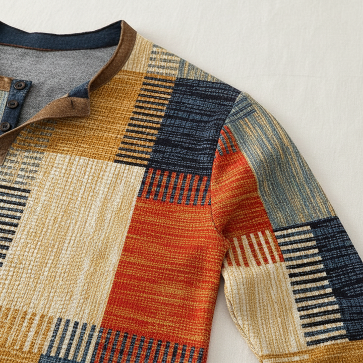 Close-up of a men's knitted cotton long sleeve sweater texture in a neutral color.