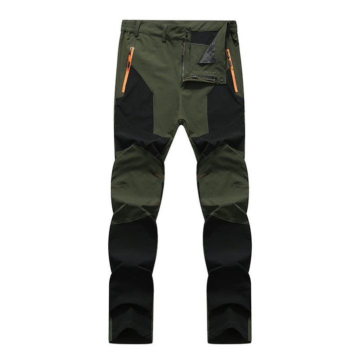Men's heavy-duty waterproof work pants, durable, warm, ideal for outdoor winter work & rain protection.