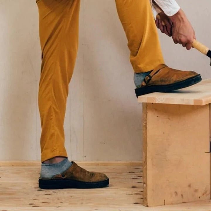 Trendy men's comfort mules with heel strap. Modern slip-on shoes ideal for versatile indoor & outdoor casual wear.