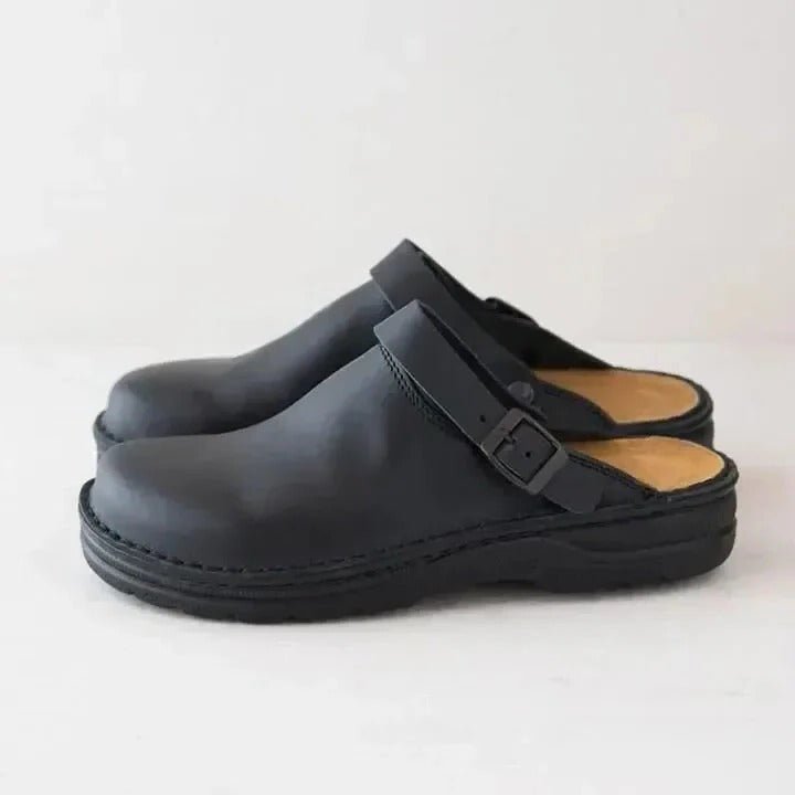 All-day comfort men's slip-on mules with heel strap. Versatile casual footwear for a modern, relaxed style.