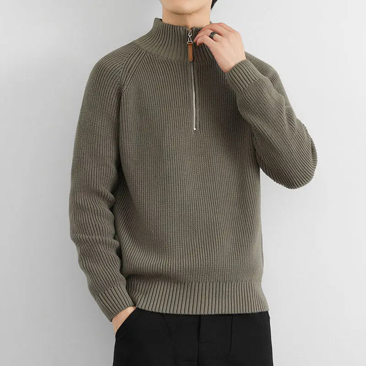Man wearing a versatile Men's Heritage Half-Zip Sweater, perfect long sleeve casual menswear for everyday fall fashion.