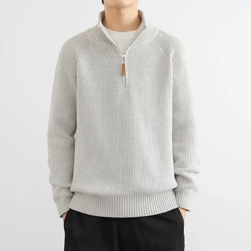 Stylish man showcasing the comfortable fit of the Heritage Half-Zip Sweater, ideal for smart casual winter outfits.
