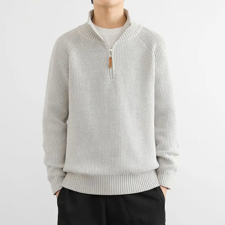 Stylish man showcasing the comfortable fit of the Heritage Half-Zip Sweater, ideal for smart casual winter outfits.