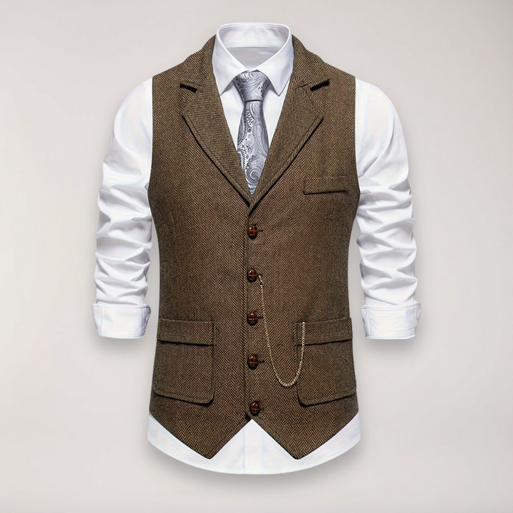 Close-up of elegant men's herringbone vest fabric, showcasing sophisticated texture & reversed collar detail.