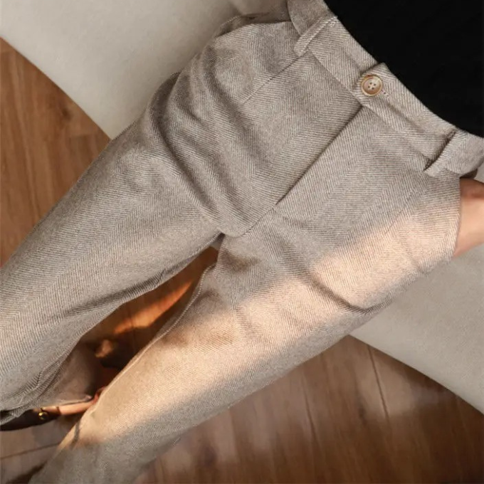 Men's tailored herringbone wool dress trousers, a classic for business and formal occasions.
