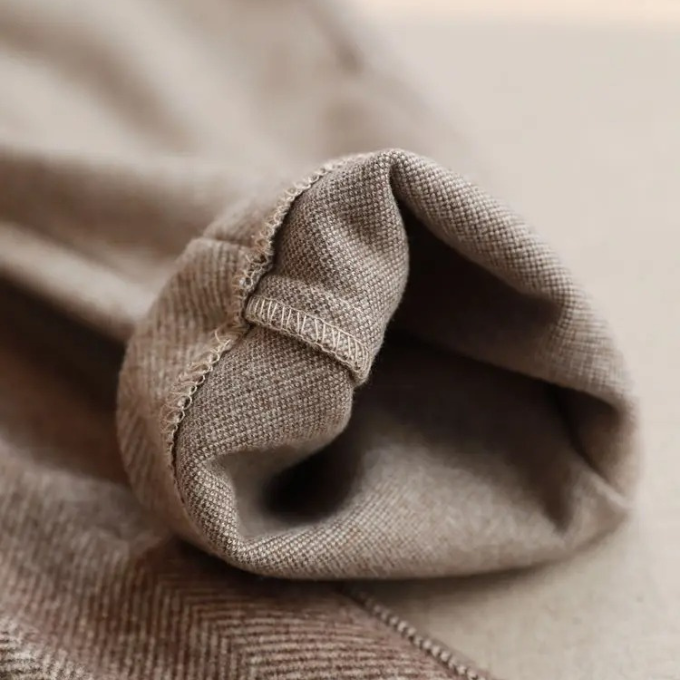 Comfortable men's wool herringbone dress pants, merging classic style with ease for work.