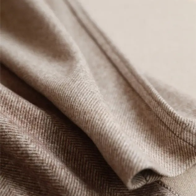 Distinctive herringbone pattern wool trousers for men, ideal for tailored formal looks.