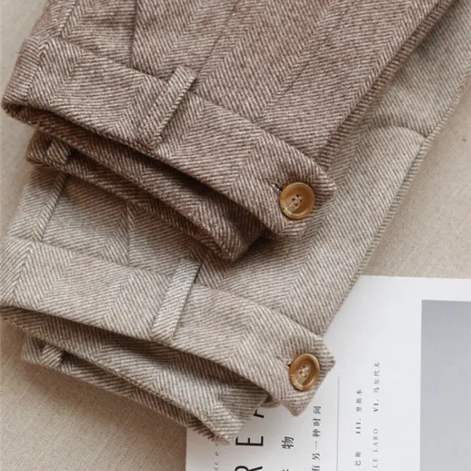 Sophisticated men's herringbone wool dress pants, perfect for a sharp, formal business attire.