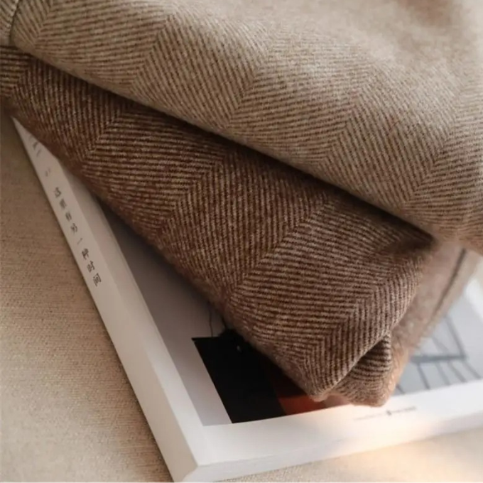 Men's classic herringbone wool trousers, tailored for comfort and enduring business style.