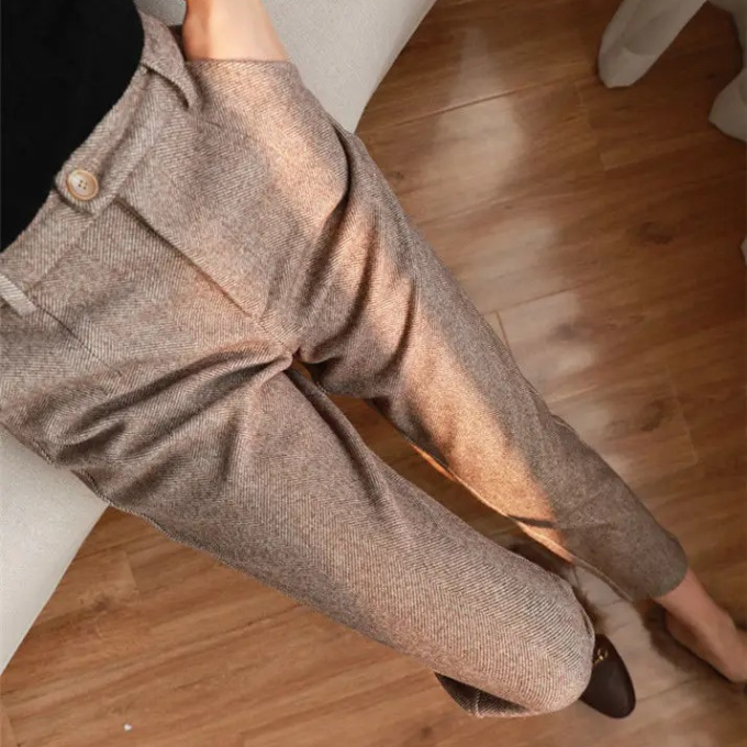 Classic men's tailored wool herringbone dress pants, perfect for business or formal events.