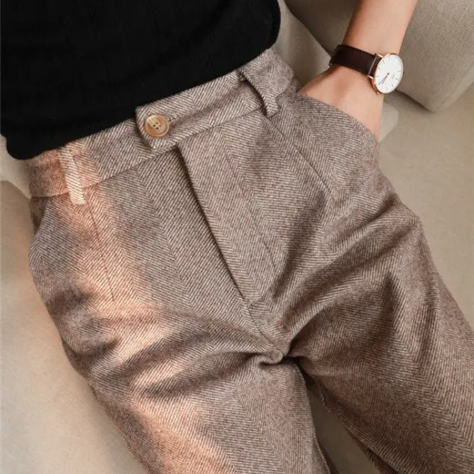 Sharp slim-fit men's herringbone wool dress trousers, great for a modern formal outfit.