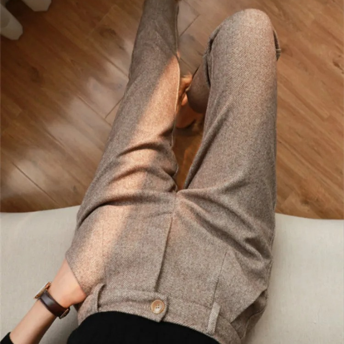 Tailored men's herringbone wool dress pants, offering comfort and timeless business style.