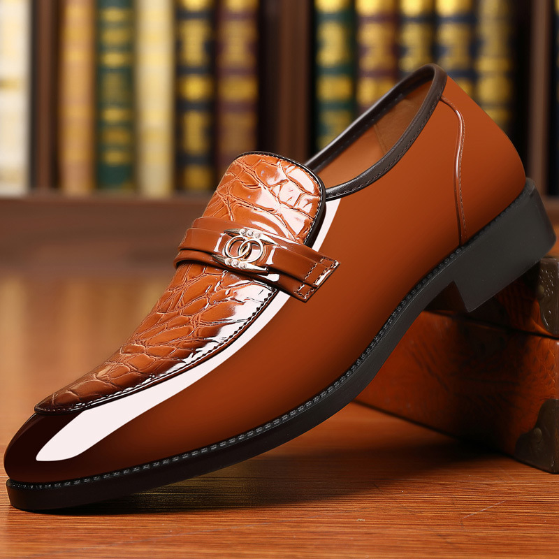 Men's high-shine loafers with textured vamp & gold accent; a classic slip-on for formal wear.