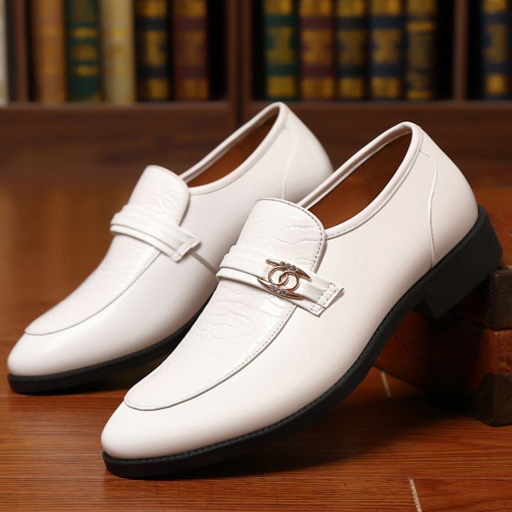 Men's high-shine slip-on loafers, featuring a unique textured vamp and subtle gold accent.