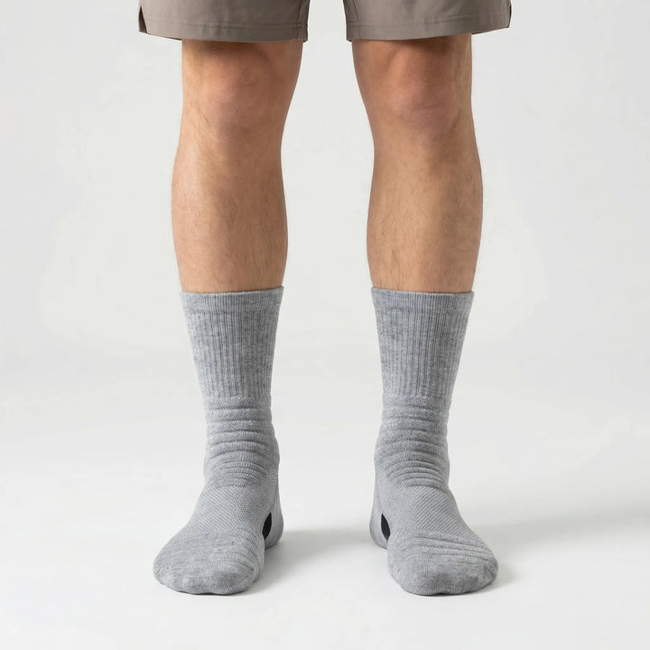 Moisture-wicking men's high-tube athletic socks, 3 pairs, offering compression for peak sports performance.