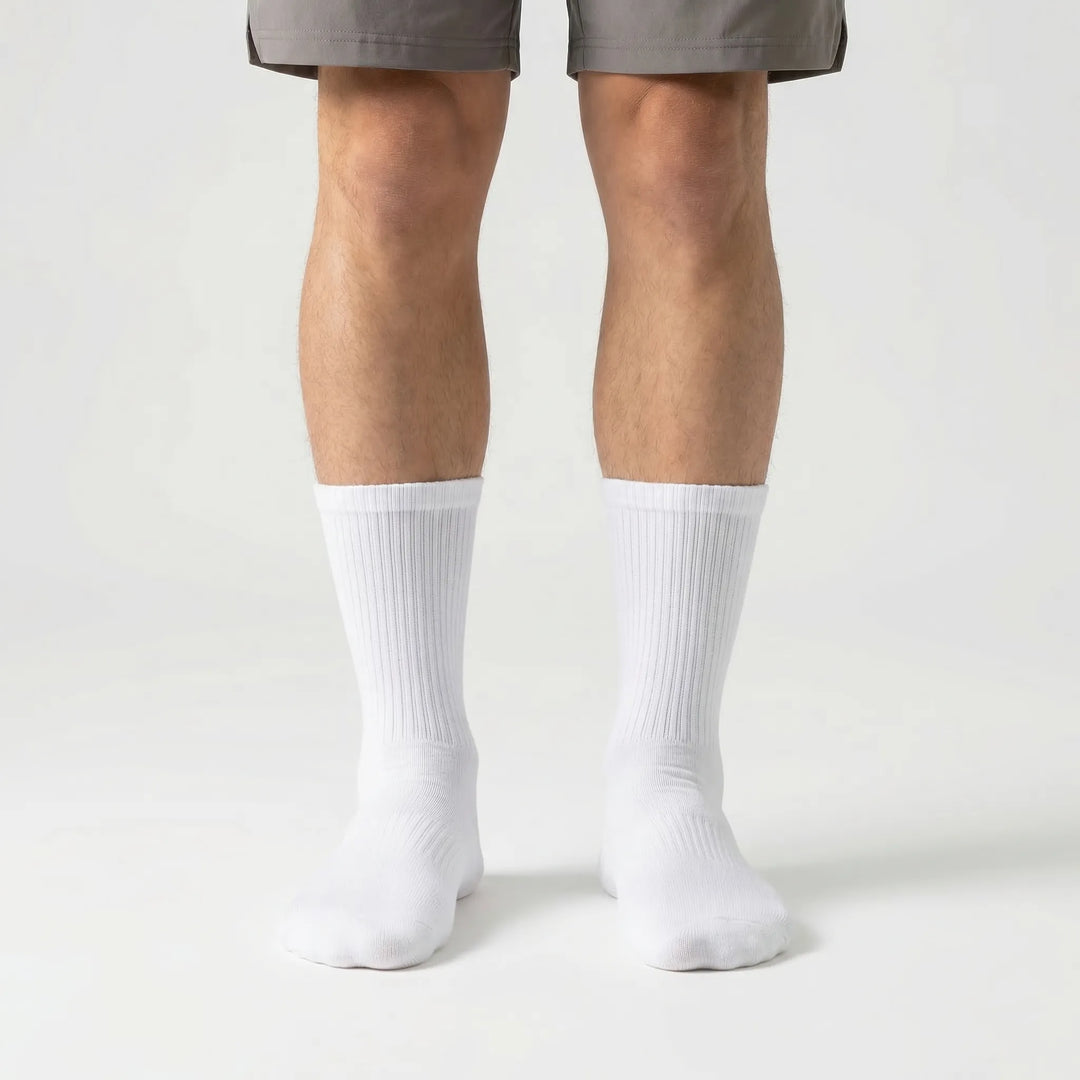 Durable men's high-tube compression sports socks (3-pack), essential workout gear for athletes.