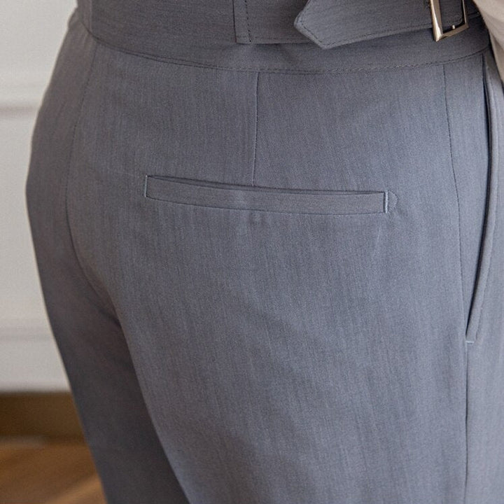 Formal men's fashion: high-waisted Gurkha trousers, a key piece for classic workwear.