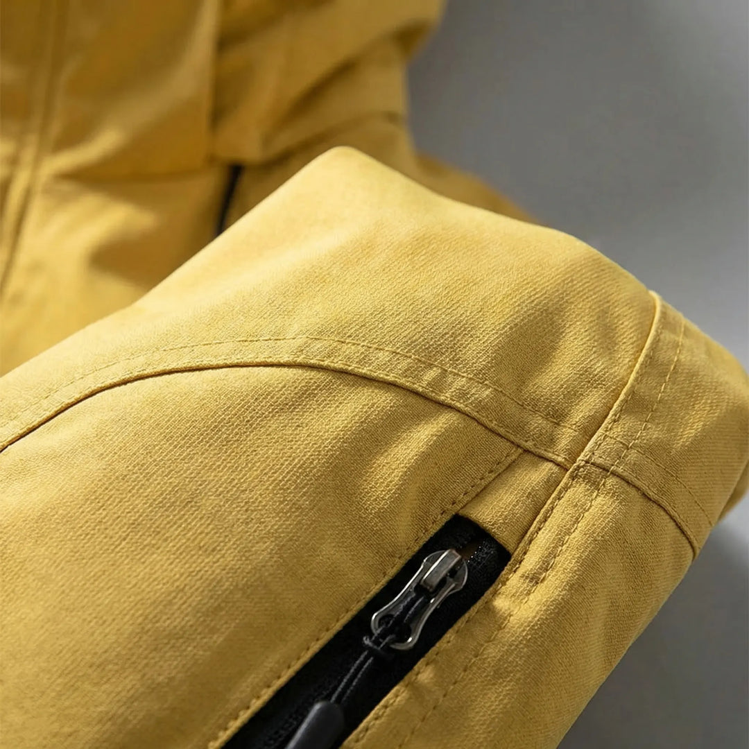 Spring/fall men's softshell windbreaker jacket with hood, water-resistant outdoor gear for active lifestyles.