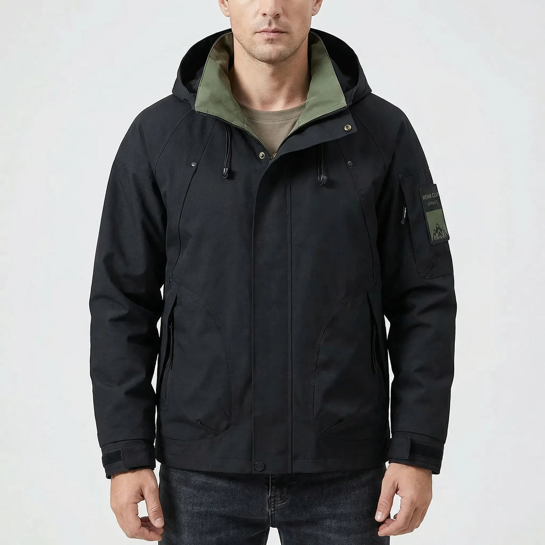 Man wearing lightweight hooded softshell windbreaker, perfect for active outdoor adventures & camping.