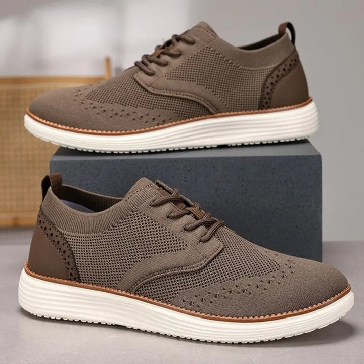 Modern men's hybrid shoes, formal casual lace-up wingtip design.