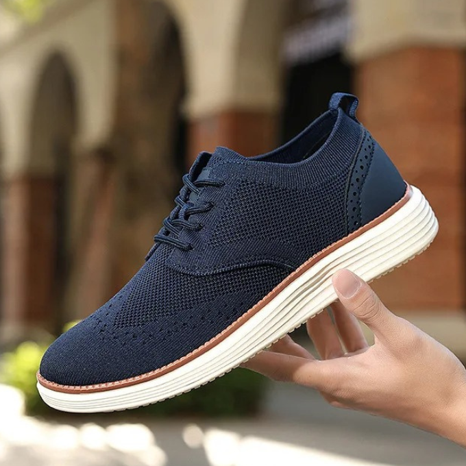 Wingtip men's hybrid sneakers, sophisticated lace-up design for daily wear.